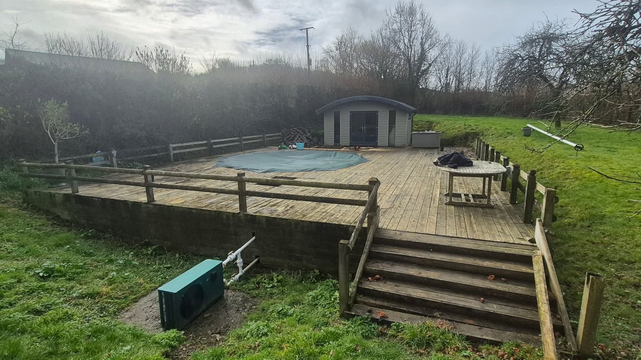 Old deck around the pool before replacement