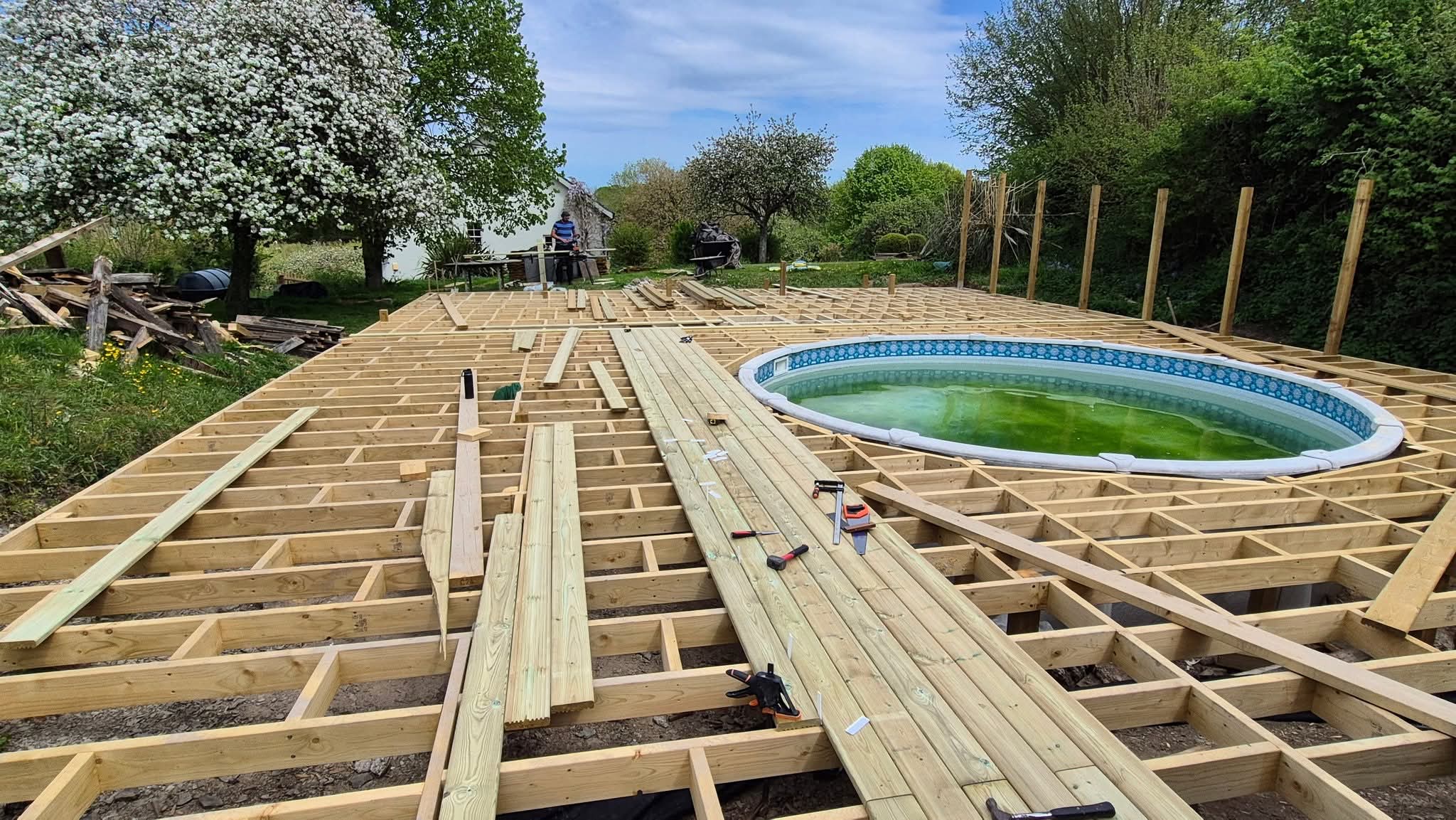 Large new deck around a swimming pool in Devon