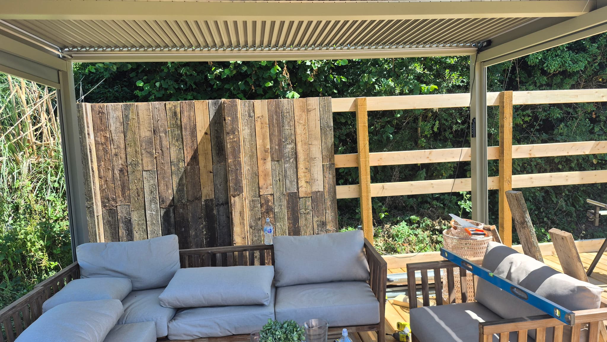 New timber rails going up alongside the reclaimed timber privacy screen