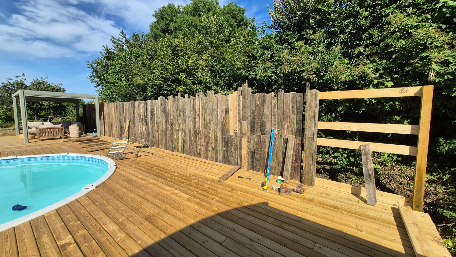 The old deck timber rebuilt as the fence and screening around the new deck