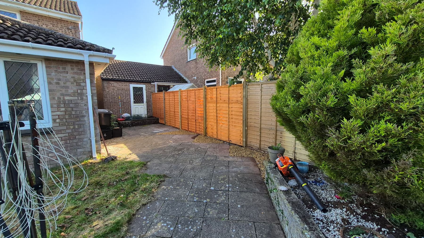 New fence with a clean gravel finish along the base