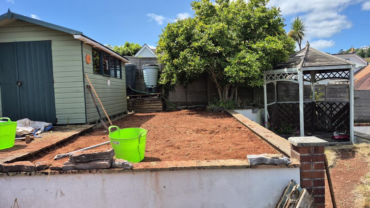 Garden stripped back to red Devon soil