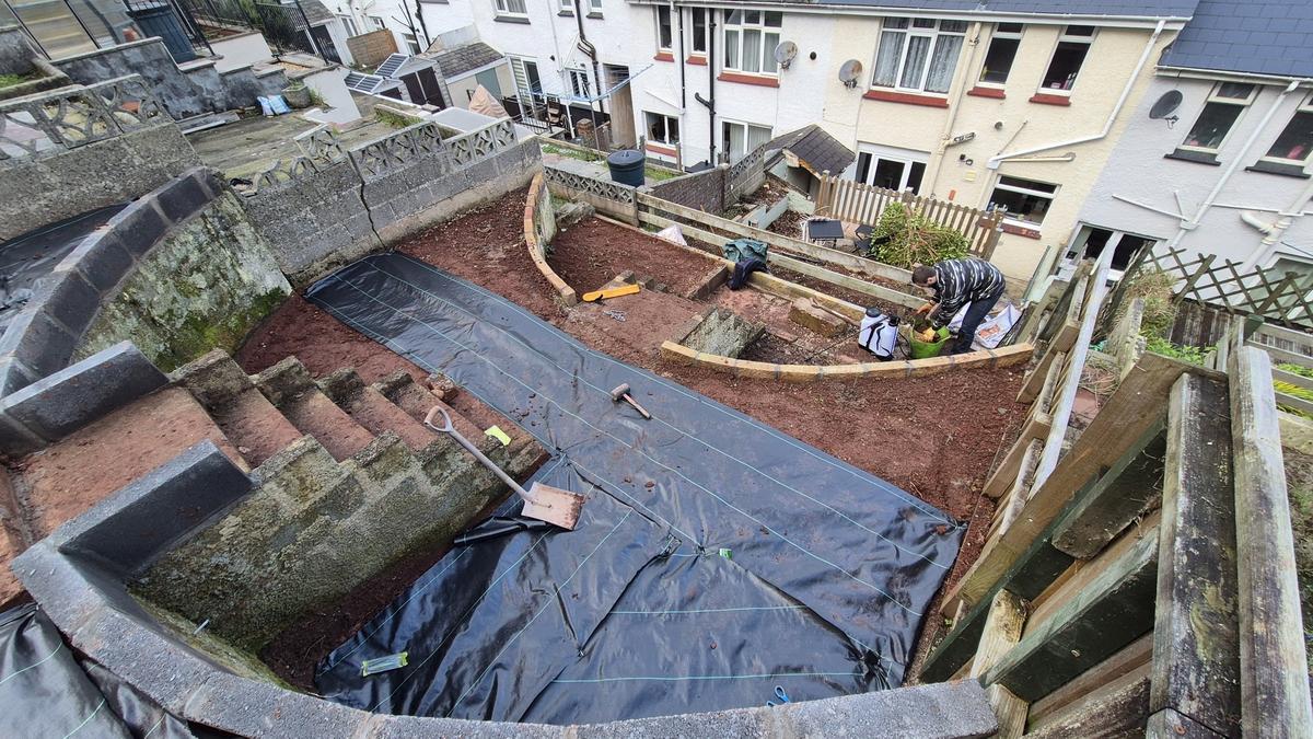 Membrane laid across terraced levels from above